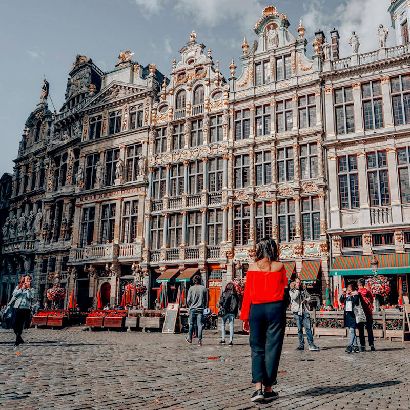 Girl walking around Grand Place in Brussels, Belgium