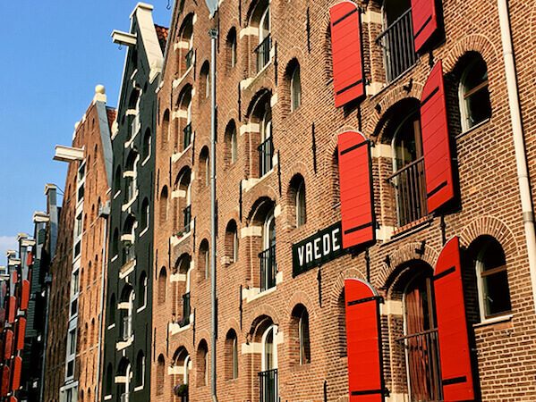 Beautiful warehouse on the Westelijke Eilanden in Amsterdam. This off the beaten path neighborhood in Amsterdam is quiet and beautiful to explore! #amsterdam #holland #travel #netherlands