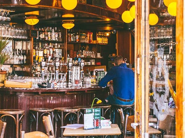 Interior of a cozy brown bar in the Jordaan neighborhood of Amsterdam. You must experience a brown bar (a classic Dutch bar!) while in Amsterdam! #amsterdam #holland #netherlands #nederland