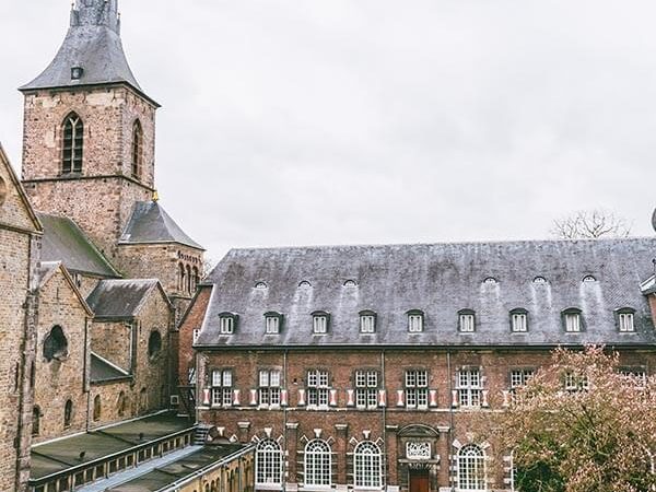Photo of Abdij Rolduc, an abbey hotel in the Netherlands near Aachen, with a picturesque courtyard.