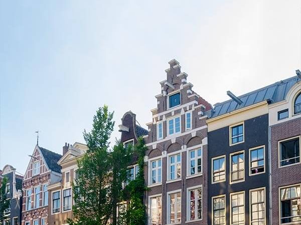 Beautiful daytime photo of the Red Light District in Amsterdam with coffeeshops and cafes.