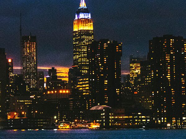Empire State Building with skyline of New York after dusk