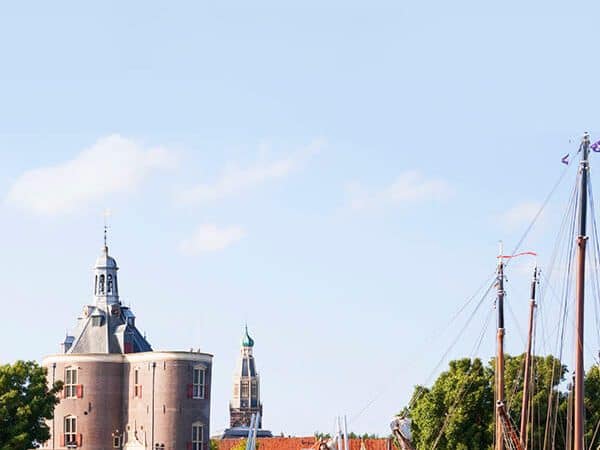 Picturesque view of Enkhuizen including the drommedaris and ships.
